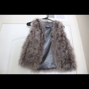 Small fur extremely soft vest. Purple gray color
